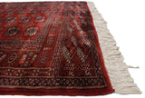 Intact red side cord selvage and full ivory fringe on a plush vintage Bokhara rug runner.