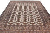 Angled view of a fine Bokhara carpet highlighting the lustrous sheen across its repeating gul pattern.