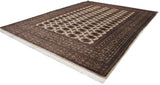 Angled perspective of a fine Bokhara carpet, highlighting its plush wool and repeating gul medallions.