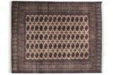 Detailed repeating Bokhara gul medallions in beige and bronze on a fine weave.