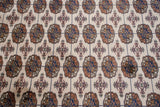 Detailed Bokhara gul medallions in beige, navy blue, and pale bronze.