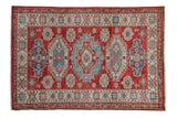 Hand knotted Pakistani Caucasian design rug with cherry red and blue Soumac medallions.