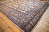 Vintage Bokhara rug's hand-knotted light fringe and camel side cord selvage.