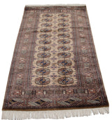 Plush camel pile Bokhara runner, highlighting geometric elephant footprint design motifs.