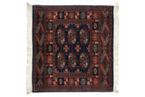 Vintage Bokhara rug with columns of rust and ivory gul medallions on a navy blue field.