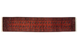 A fine-weave Bokhara runner with repeating gul medallions in navy and ivory on a copper field.
