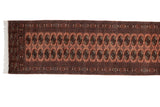 Finely woven vintage Bokhara runner with repeating gul medallions on a dusty rose field.