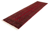 Ivory fringe and finely woven cherry red, navy gul medallions on the Bokhara runner.