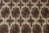Fine, plush weave showing repeating geometric gul medallions in a vintage Bokhara carpet.