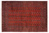 Fine vintage Bokhara carpet with repeating gul medallions on a brick red field with navy accents.