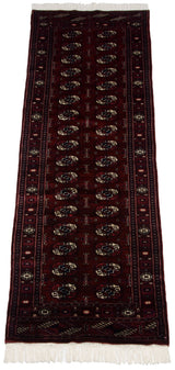 Fine Bokhara runner shown from an angle, highlighting its repeating gul medallions on a plush wine-red pile.