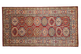 Hand knotted Pakistani Kazak rug, Moghan medallion guls in gem-toned red, blue, and ivory.