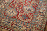 Vibrant Moghan Kazak guls in cherry red, sapphire, ivory, and powder blue border design.