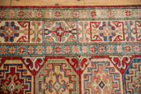 Moghan style Kazak geometric patterns in cherry red, sapphire blue, and ivory.