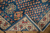 New Pakistani Caucasian design rug corner, indigo blue field, ivory geometric border, and blue selvage.