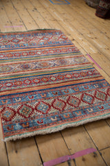 Pakistani Khorjin rug featuring horizontal stripes, geometric medallions, avian motifs, and gem-tone colors.