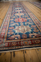 Pakistani runner with sapphire blue field, detailed finned bird and quatrefoil floral medallions in rich hues.