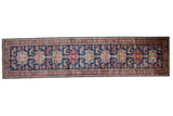 New Pakistani Caucasian design runner rug, sapphire blue field with geometric medallions in cherry red and ivory.
