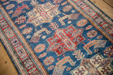 Pakistani Caucasian design runner's intricate geometric border in red, ivory, and teal.