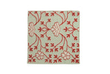 Square Indian rug in a Samarkand design with raised red and ivory floral petals on a pale green background.