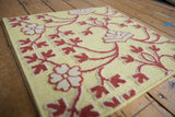 Angled view of the Samarkand rug's mixed texture with raised floral pile.