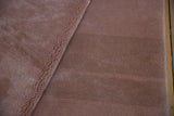 Plush, blankety feel of the dusty rose pile on the vintage Japanese carpet.