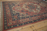 Vintage Indian Serapi Soumac design carpet with madder red field, ornate vinery, and abrashes.