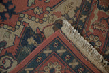 Hand-knotted vintage Indian Serapi rug fringe and border in madder red and dark teal.