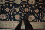 Vintage Indian Sultanabad Soumac design carpet showing charcoal field, dusty pink florals, delicate vinery, and antique ivory border.