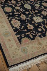 Intact selvage, dusty rose and beige border of the vintage Soumac rug with ivory fringe.