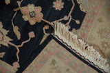 Secured ivory fringe, black selvage, and dusty rose floral border of the Sultanabad Soumac rug.
