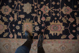 Expressive serrated floral field in charcoal navy, pink, and sand, with patterned border.