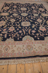 Vintage Indian Sultanabad carpet border with faded red, blue floral motifs and natural ivory fringe.