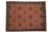 Vintage Indian Arts and Crafts carpet with a Soumac trellis design in terracotta and navy.