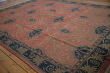 Angled view of the Arts and Crafts carpet showing floral palmettes and interconnected vinery.