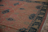 The vintage carpet's navy and beige border and original selvage edge.