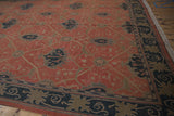 Interconnected vinery and floral palmettes seen from an angle on the vintage Indian rug.