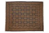 Vintage Indian Agra Soumac carpet, repeating cartouches with floral motifs, wave border in teal, gold, madder.