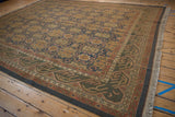 Vintage Agra Soumac carpet: dusty teal wave border and multi-paneled floral field.