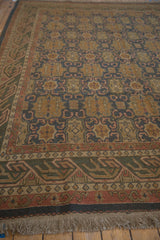 Detail of vintage Agra Soumac carpet fringe with dusty madder root wave border.