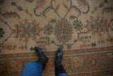 Vintage Indian Sultanabad Soumac carpet with floral medallions in dusty aubergine, gold, teal.