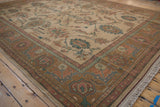Curvilinear floral field and dusty aubergine border on a vintage Indian Sultanabad Soumac rug.