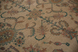 Intricate dusty aubergine, teal, and gold lotus motifs on a Sultanabad Soumac carpet.