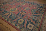 Fringed edge and dusty teal cartouche panels of the vintage Indian Soumac rug border.
