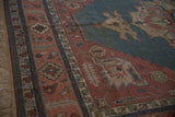 Madder root red border with serrated leaf and floral motifs on teal Serapi rug, fringe.