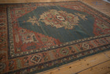 Terracotta and dusty teal serrated leaf border on vintage Indian Soumac rug.