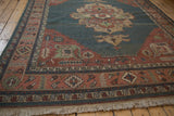Vintage Indian Serapi Soumac rug's madder red border with serrated leaf motifs and fringe.
