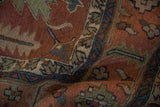 Textured pile of vintage Serapi Soumac rug with abrashed terracotta, teal, and ivory motifs.