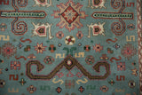 Dusty powder blue vintage Indian Shirvan rug, showing detailed Perpedil and starburst motifs.