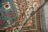 Rolled vintage Indian Shirvan rug: plush pile, dusty blue, ivory, blush Perpedil motifs.